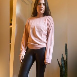 Sweater with the word Love embroidered in upper corner.